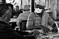 The Masked Dominoes Player